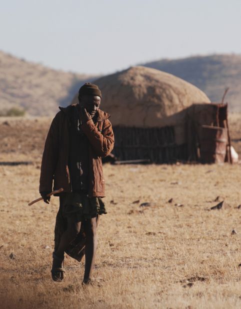 Himba homes are round structures constructed of sapling posts, which bound together to form a conical roof plastered in mud and dung.