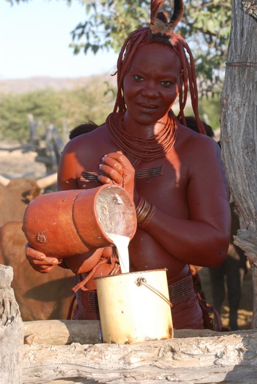 Every morning, Himba women wake at or before dawn, apply their <em>otjize</em>, then milk the livestock.