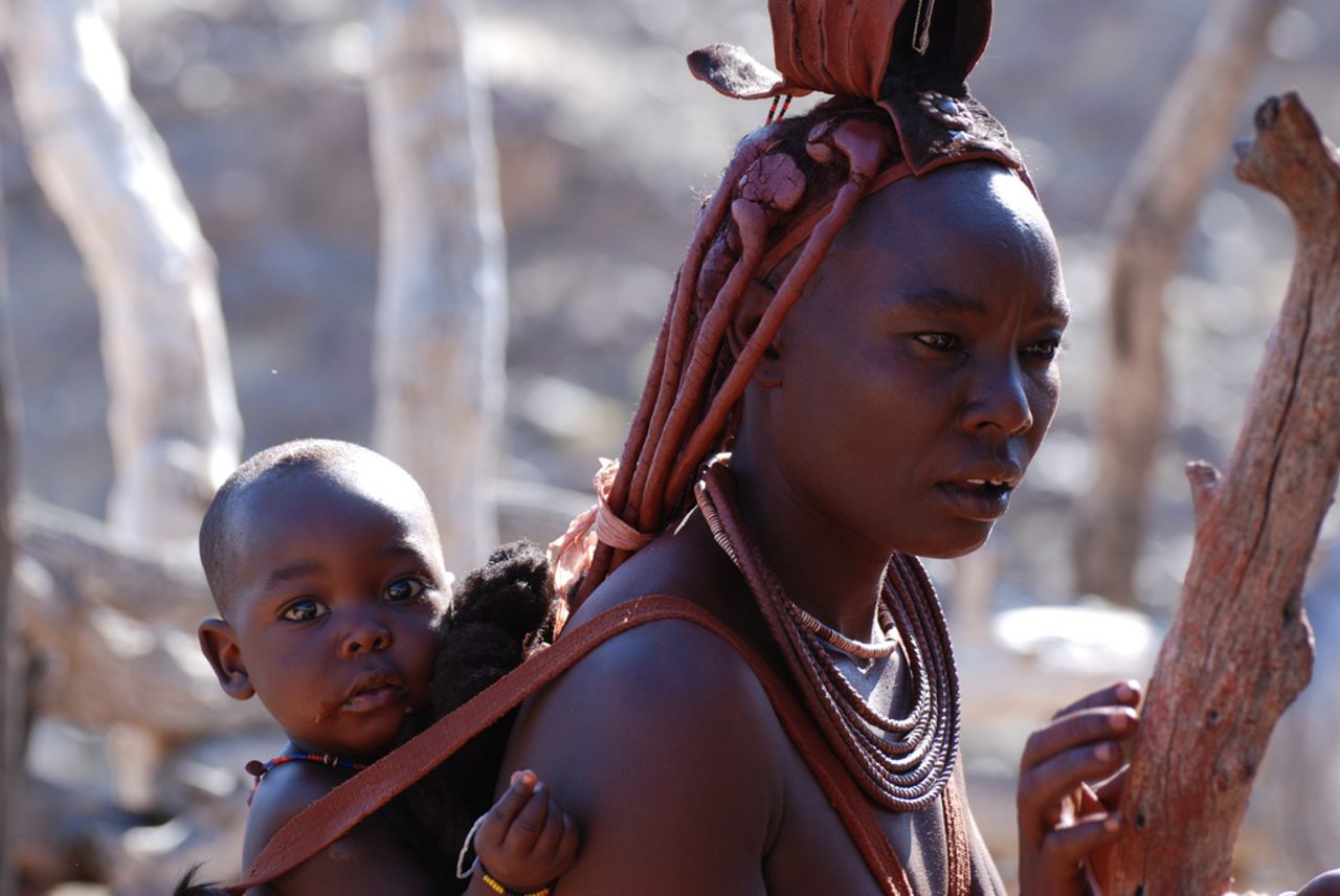 Himba children stay with their mother until the age of three, when they live with their siblings and are cared for by all members of the village.
