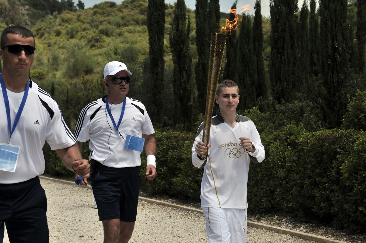 Loukos grew up in east London, where the Olympic Stadium is situated, but his father hails from Greece. Making its way to Britain, the flame will first take in Greek archaeological sites including the Acropolis and Olympic Stadium in Athens, site of the first modern Games in 1896.