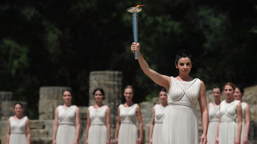 ATHENS, GREECE - MAY 10: High Priestess Ino Menegaki lights the Olympic flame at the Temple of Hera during the Lighting Ceremony of the Olympic Flame at Ancient Olympia on May 10, 2012 in Olympia, Greece. (Photo by Jamie McDonald/Getty Images) 