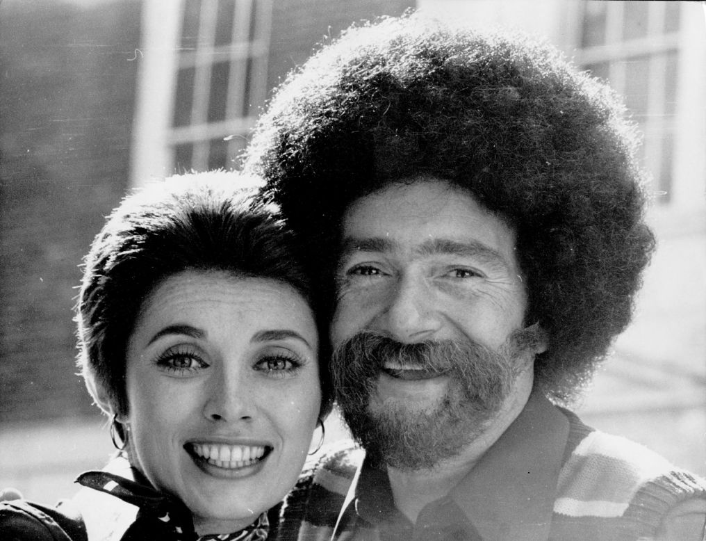 Vidal Sassoon, with his second wife Beverly, wearing a false beard, sideburns and wig, to mark the opening of his new barbers shop in 1972. He divorced three times and married his fourth wife in 1992. 