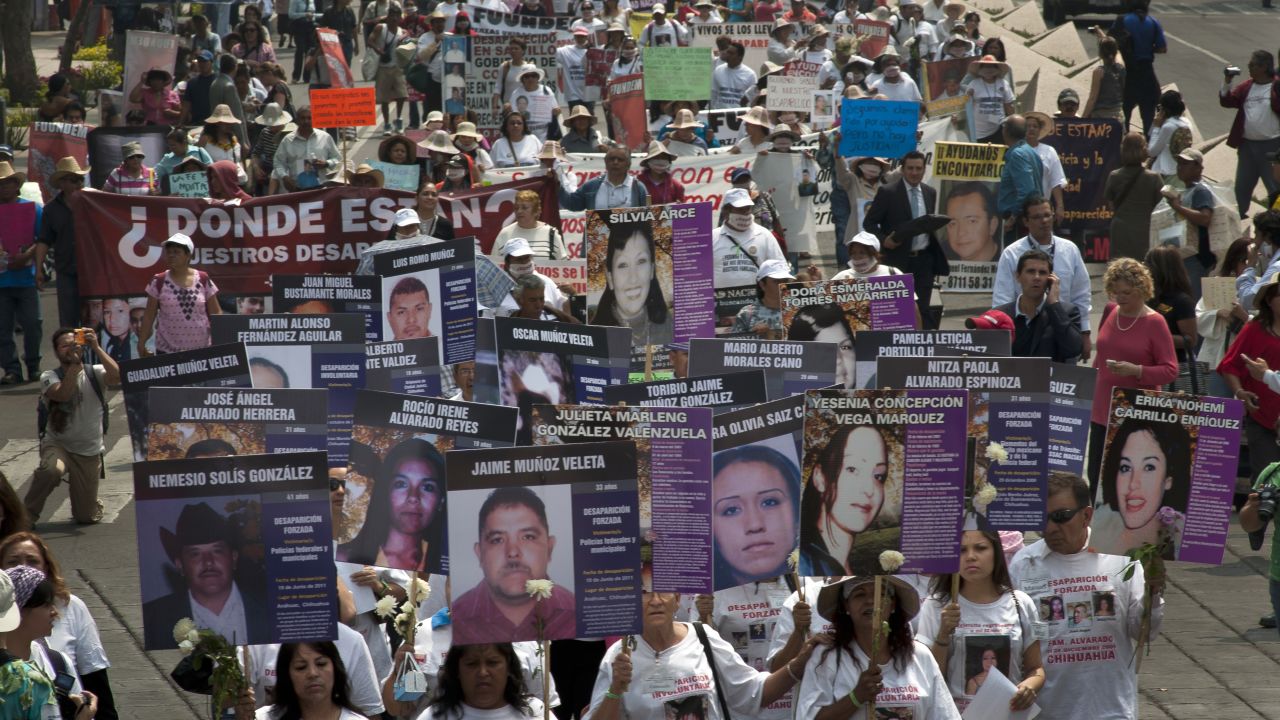 Hundreds from different states in Mexico march in Mexico City against forced disappearance Thursday.