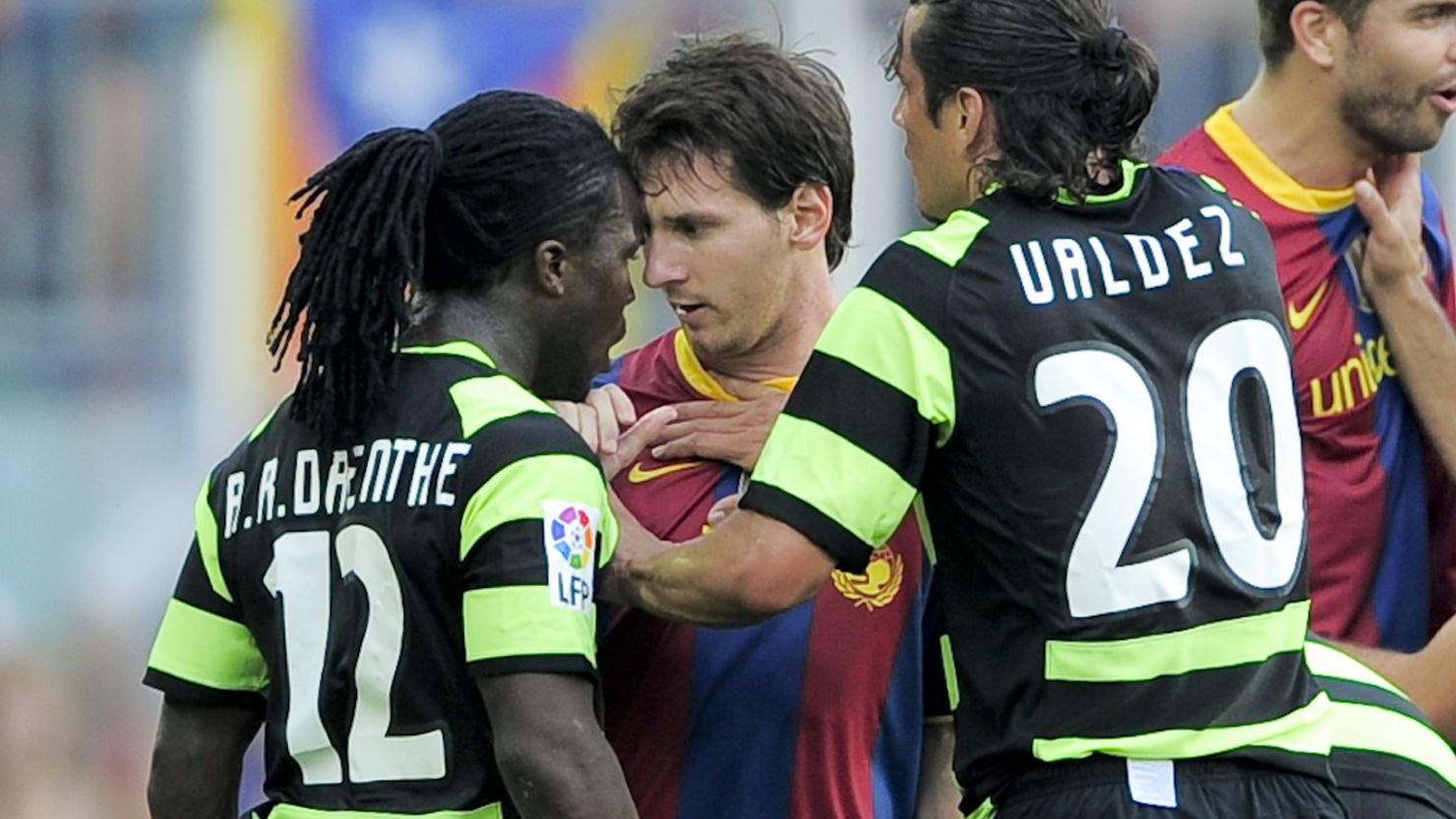 Royston Drenthe clashed with Lionel Messi while playing for Hercules against Barcelona in 2010.