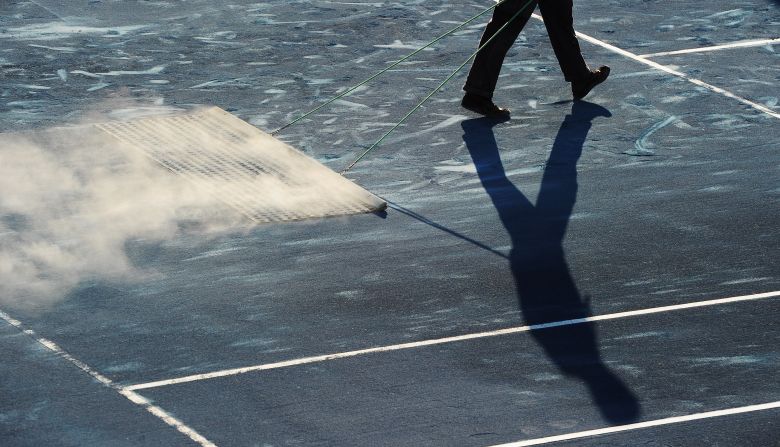Performance specialist Alistair McCaw says the slippery surface isn't due to the color but the implementation. "The amount of clay covering the surface is lesser than normal. If you dig your foot into the surface and remove some of the clay, you will notice that the underlying surface is a hard rubber-like mat," he said.