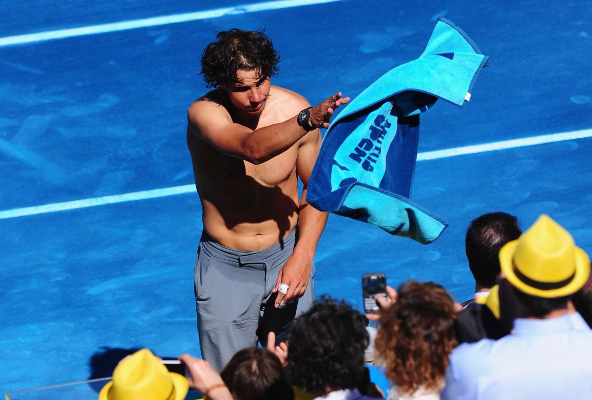 Nadal throws his towel -- emblazoned with the logo of sponsor Mutua Madrilena -- into the crowd. Tiriac says improving the experience for television viewers watching his $10.6 million tournament was a major factor in the switch to blue.