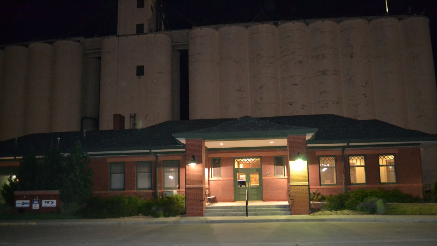 The train station in Garden City Kansas where Amtrak's Southwest Chief arrives twice a day, stands before a bank of grain elevators.