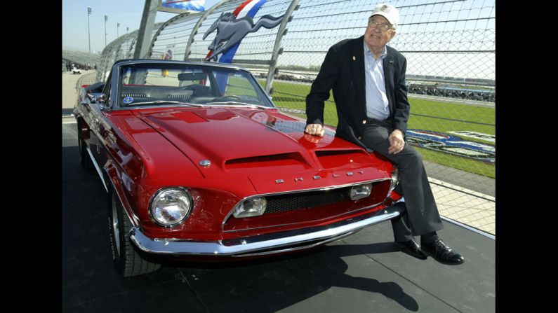 Shelby sits on a 1968 GT500 KR during the celebration of the 40th anniversary of the Ford Mustang in 2004 in Lebanon, Tennessee. Shelby was the greatest single influence on America's racing posture in the post-1945 period with help in the engine design and racing operations of the Mustang.