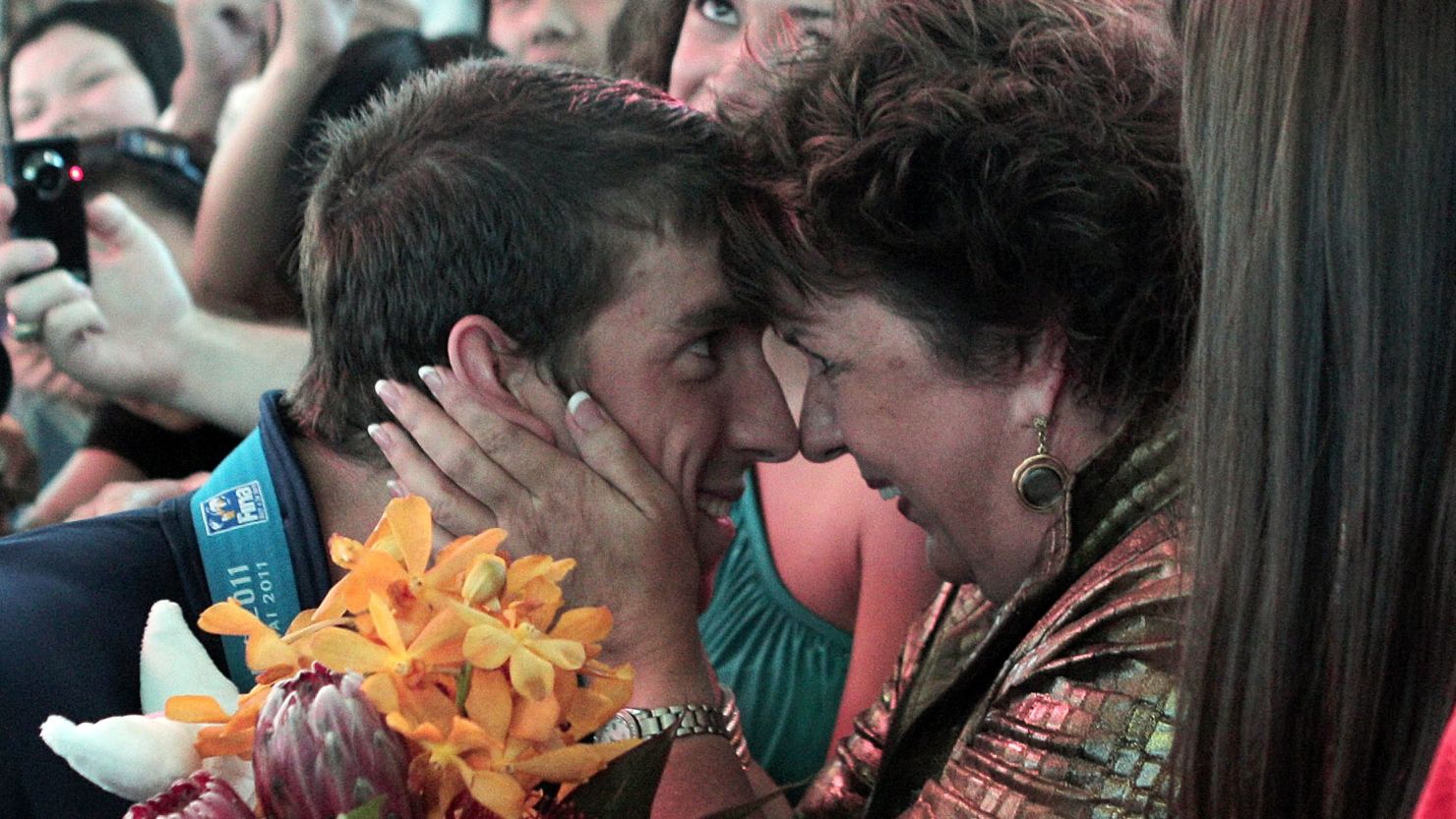 Olympic swimmer Michael Phelps is congratulated by his mother, Debbie, after a competition in Shanghai, China, last July