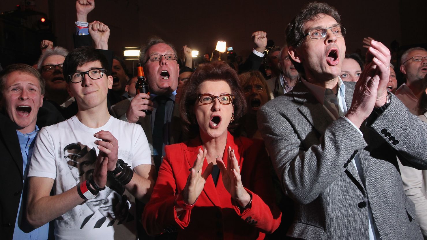 Supporters of the Social Democrats cheer initial exit poll results on Sunday in Dusseldorf, Germany.