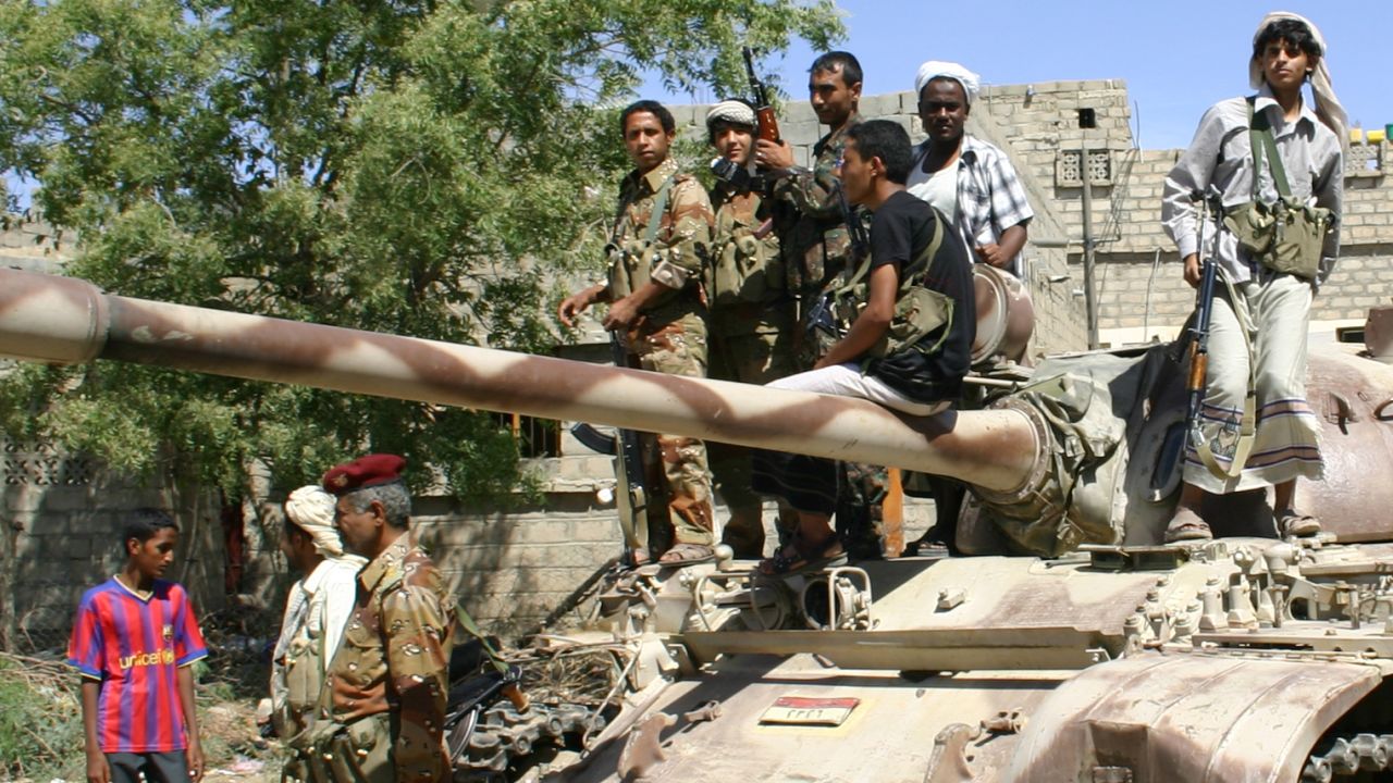 Yemeni troops gather atop an army tank during a lull in fighting against suspected al Qaeda militants on May 6.