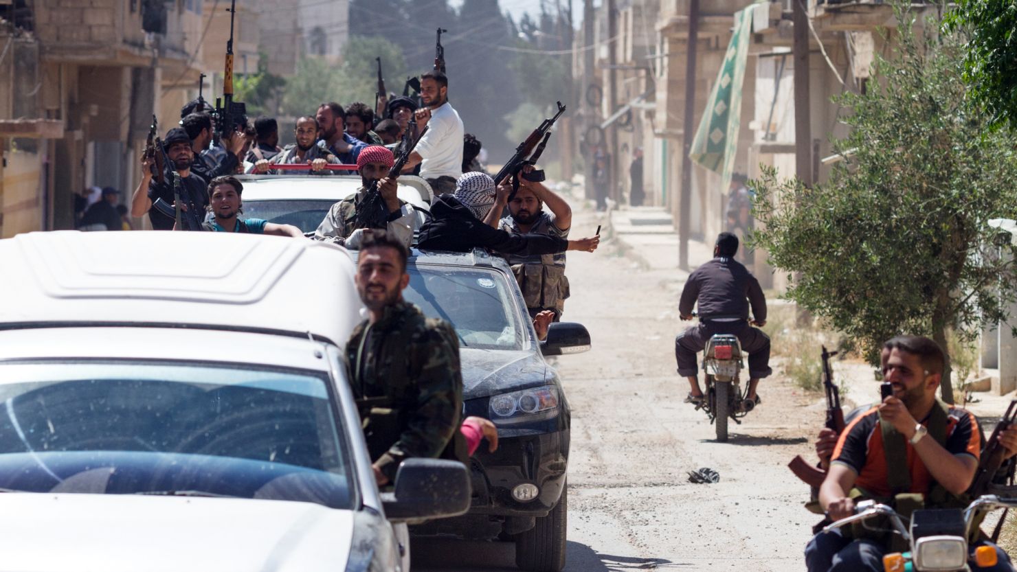 Members of the Free Syrian Army return to Qusayr after an attack near the Lebanese border on Saturday.