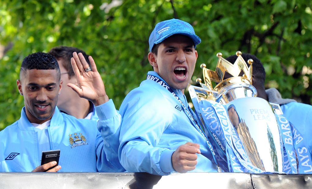 Sergio Aguero, the scorer of the late goal which clinched the EPL title for Manchester City, acknowledges the City fans during the parade.