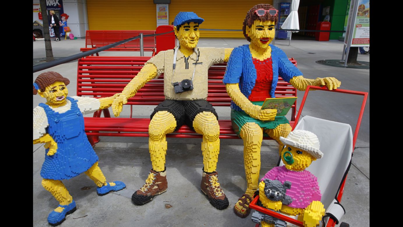 A family made of Lego bricks sits on a bench Tuesday at the Legoland theme park in Guenzburg, Germany. The park will celebrate its 10th anniversary on Thursday. 