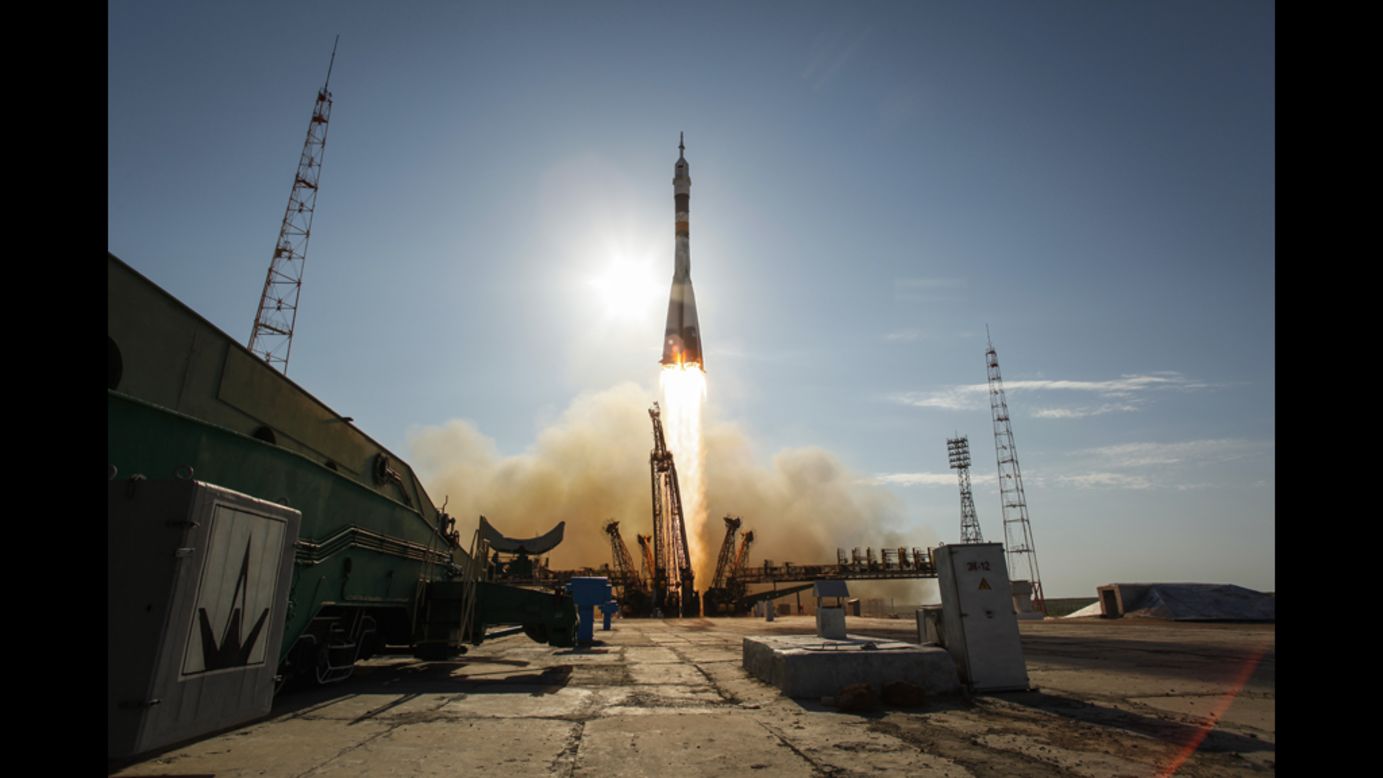 In an image provided by NASA, the Soyuz TMA-04M rocket launches Tuesday from the Baikonur Cosmodrome in Kazakhstan. The rocket is carrying three crew members to the International Space Station.