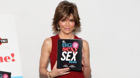Lisa Rinna shows off her book at a release party.