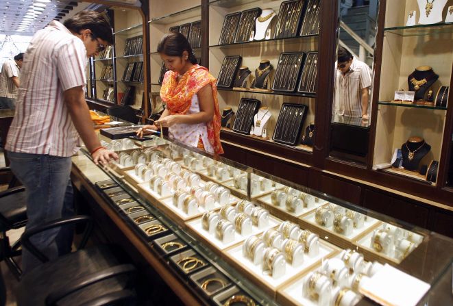 An Indian shop assistant shows a range of gold jewelry to a perusing customer. Gold signets, watches and bracelets are among the most popular adornments in India, and the capital city is a great place to bag a bargain. But be vigilant, as quality can vary greatly.