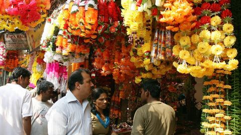 An Indian couple buy decorative items and gifts for the forthcoming Hindu festival of Diwali at a busy market in New Delhi on October 25, 2008. (RAVEENDRAN/AFP/Getty Images)