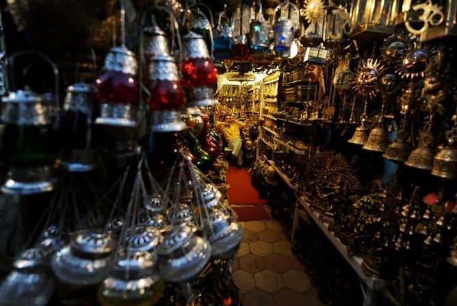 An Indian shopkeeper waits for customers as he sells decorative goods at the popular Janpath street market. Popularly known as the "Tibetan Market," it's said you'll pick up a better selection of items (from antique locks to silver jewelry) at cheaper prices here than you will anywhere in Tibet itself.