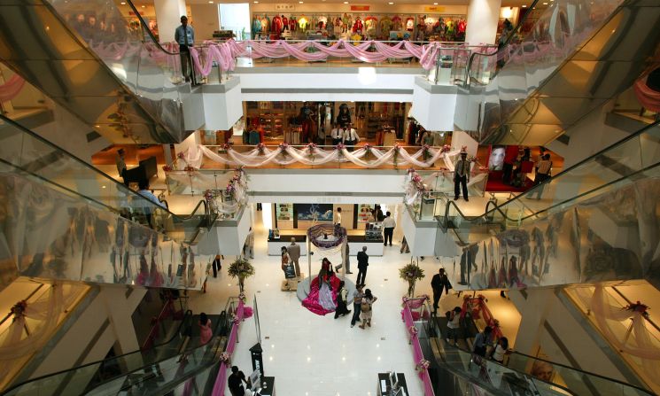 Customers are seen browsing the boutique and commercial department stores inside the "Shoppers Stop" mall. Since it opened in 2007, the mall is said to be the largest in the country, spanning an area of 135,000 square feet and providing an overwhelming range of premium international and national brands.