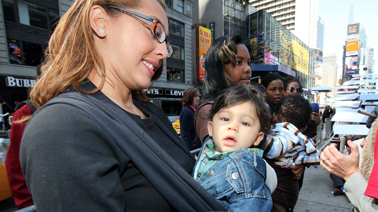 Mothers and babies attend a rally in New York. The writers say that another faux mommy war is on the horizon.