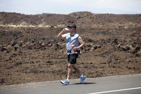 Carlos Solis, an elementary school teacher from Ontario, California, tries to stay hydrated as he runs through the lava fields.