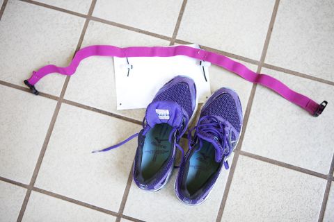 The team learns about "transition spaces," where athletes place their biking or running gear in certain positions to make it easy to go from swimming to biking or biking to running. Here sneakers are lined up with a triathlete's race number. 