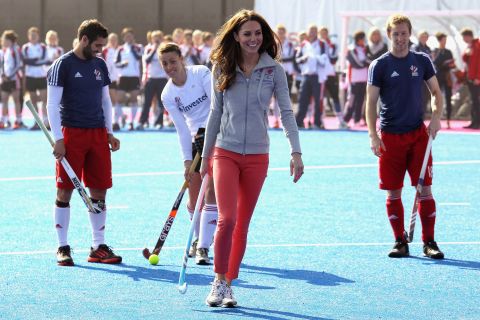 She ditched her usual heels and fascinator to play field hockey with Great Britain's women's team wearing tangerine-colored jeans.