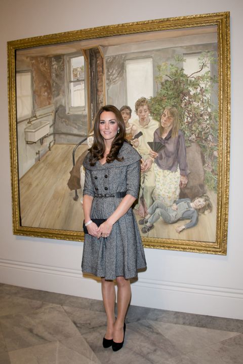 Wearing a gray coatdress, the Duchess of Cambridge posed for pictures at the National Portrait Gallery in London.