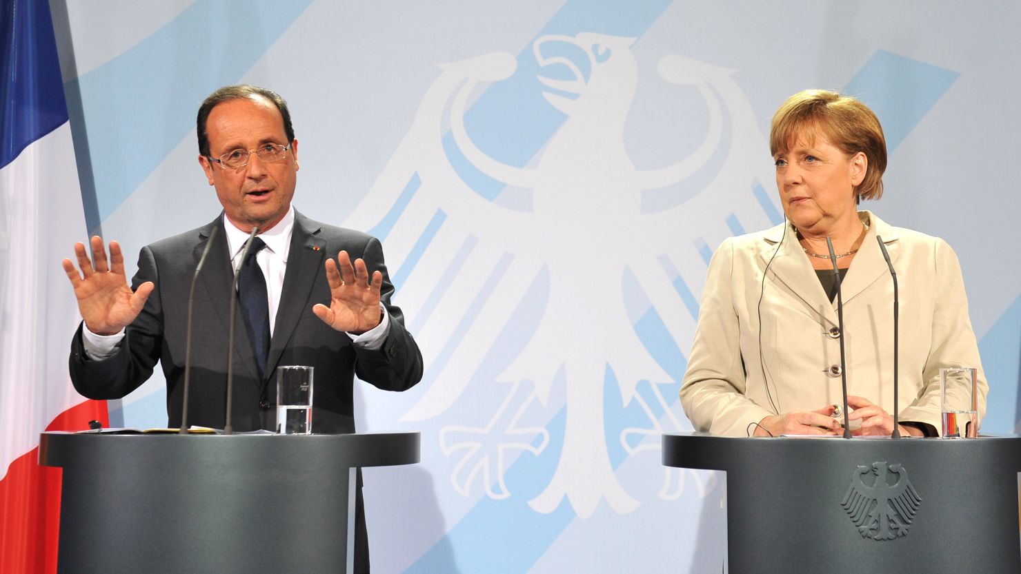 New French President Francois Hollande and German Chancellor Angela Merkel give a joint press conference Tuesday in Berlin.