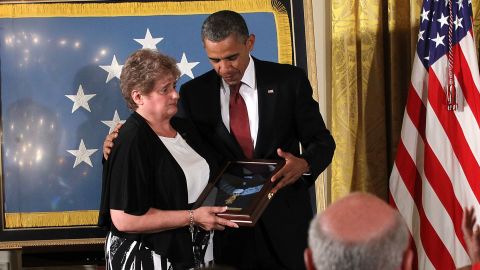 President Barack Obama presents the Medal of Honor to Rose Mary Sabo-Brown.