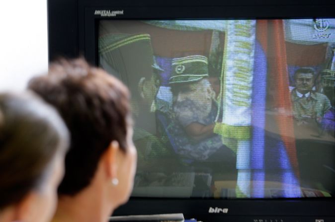 Bosnian Muslim women who survived the Srebrenica massacre, Sabra Kolenovic, right, and Sabaheta Fejzic watch the news of Mladic's arrest in Sarajevo on May 26, 2011.