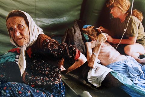 A Muslim woman and her husband are treated in July 1995 for injuries inflicted on them by Serb forces as they fled Srebrenica. The man died shortly after the picture was taken. 