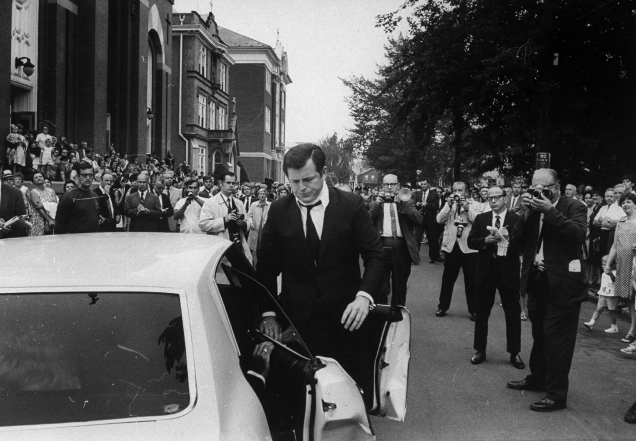 Sen. Ted Kennedy drove a car off a bridge on Massachusetts' Chappaquiddick Island after a party in 1969. Aide Mary Jo Kopechne died in the accident. He is shown wearing a neck brace at her funeral. Controversy over the incident effectively ended his presidential aspirations. 