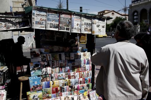 A man reads a newspaper in central Athens on May 17, 2012. Debt-laden Greece is headed for new elections next month following an indecisive vote on May 6, amid growing fears over the country's eurozone future.