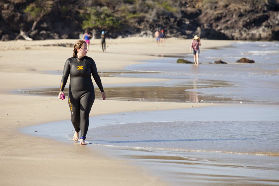 LaGier walks back along Hapuna Beach after a successful open-water swim.