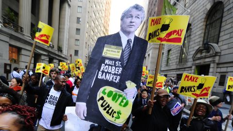 A cutout figure of JPMorgan Chase CEO Jamie Dimon hovers above a May 2011 protest against banks on Wall Street.