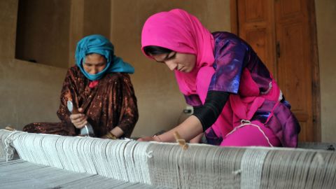 Afghan weavers work in the old city area of Kabul on May 10.