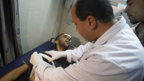 A Palestinian doctor attends to a wounded man at a hospital in Gaza City on Thursday.