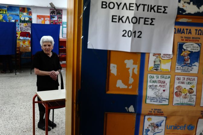 A woman waits to cast her vote during the May 6 elections. No single party won more than 20% support and talks to create a unity government failed. However, parties which oppose the austerity plans gained from popular discontent.