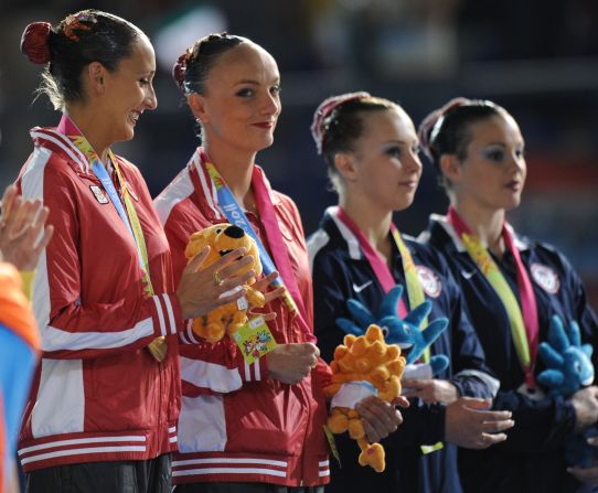 Killman and Koroleva (right) on the podium of the 2011 Pan American Games, where they won the silver medal behind the Canadian pair in the duet competition.