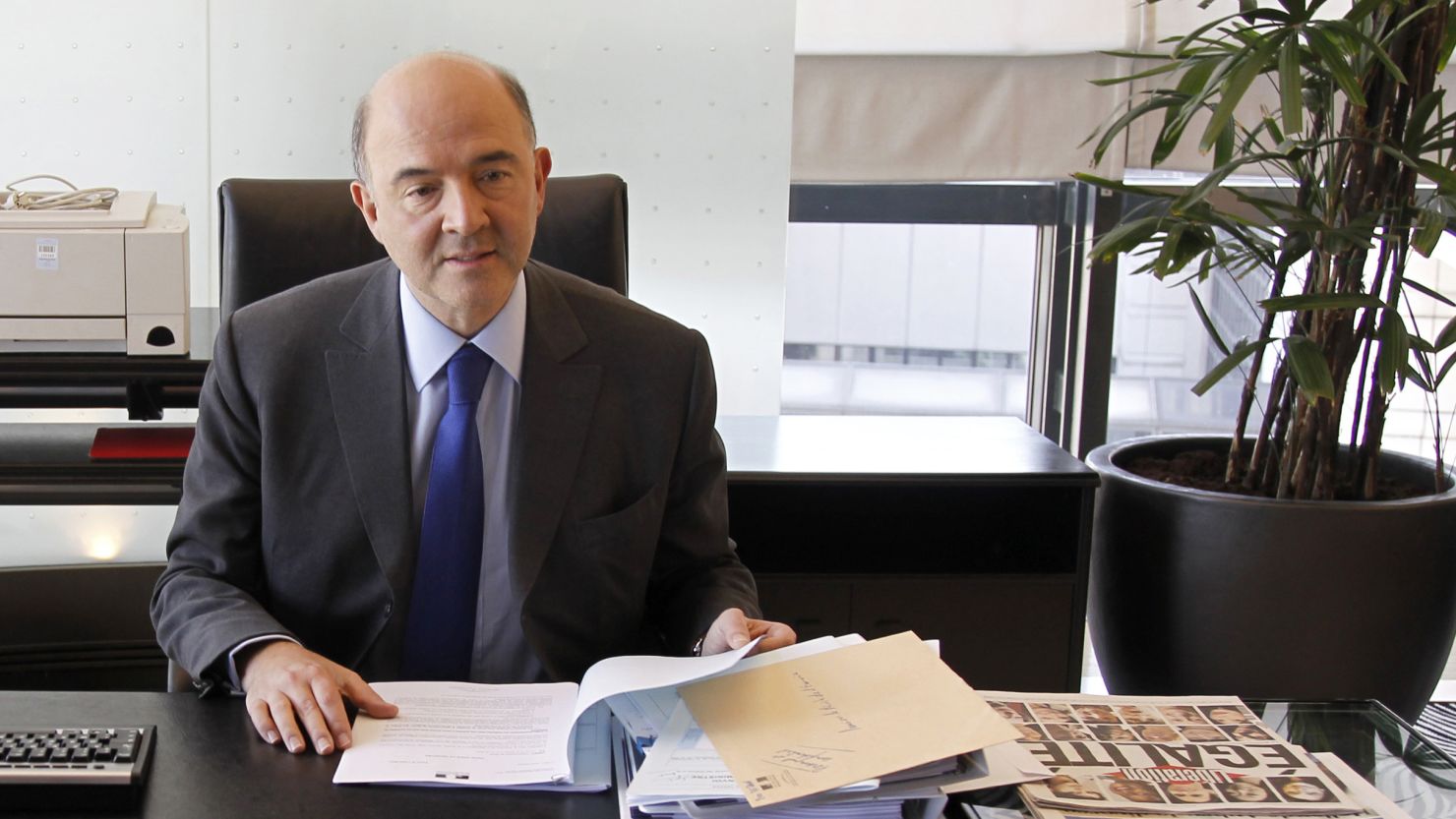 French Economy, Finance and Foreign Trade Minister Pierre Moscovici takes a seat in his office following a handover ceremony.