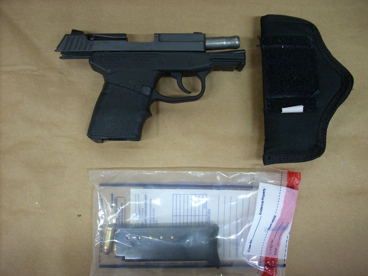 Zimmerman's gun is displayed. The shooting raised questions about gun laws, as well as the merit of the "stand your ground" law in Florida and similar laws in other states.