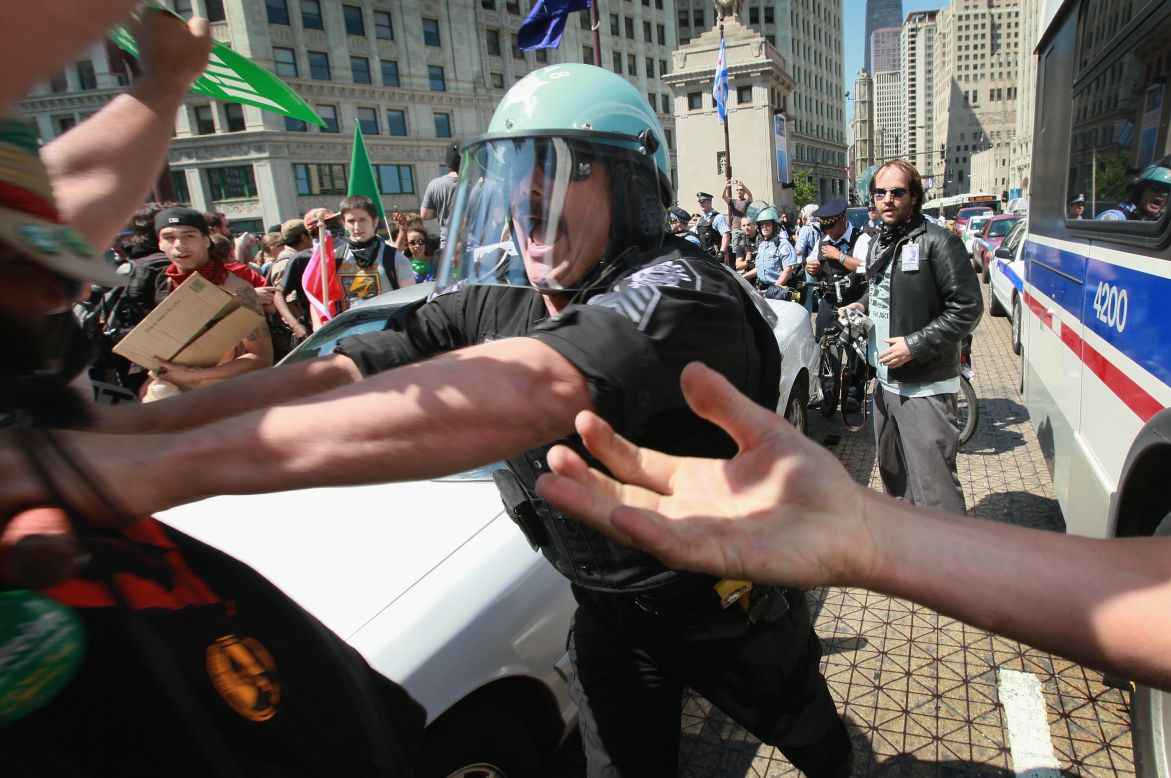 Police clash with protesters attempting to cross the Michigan Avenue Bridge in Chicago.