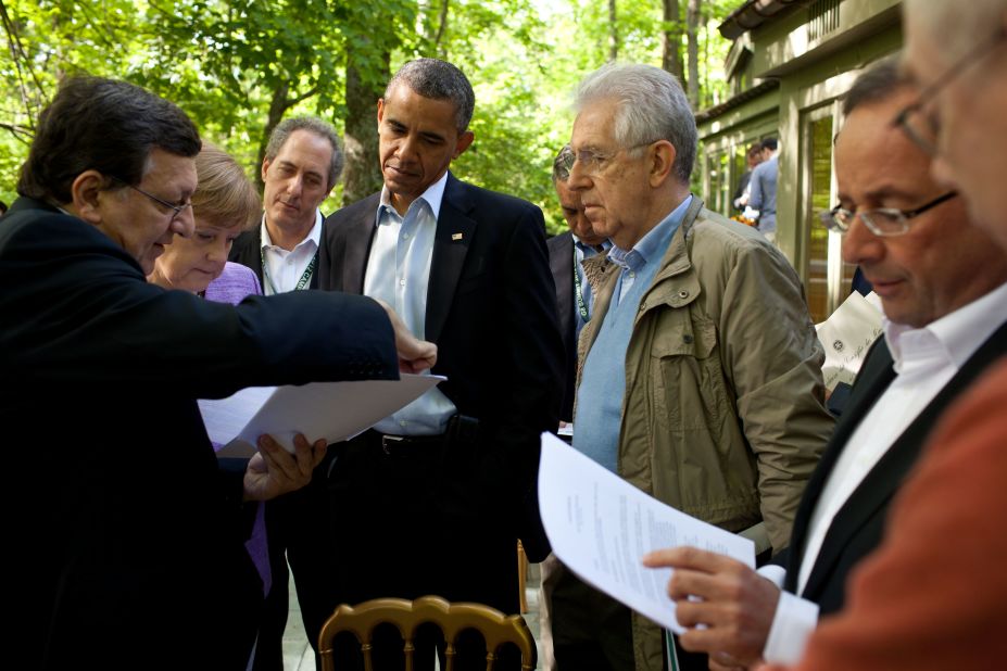  Obama and other members of the G* Summit review documents at Camp David.