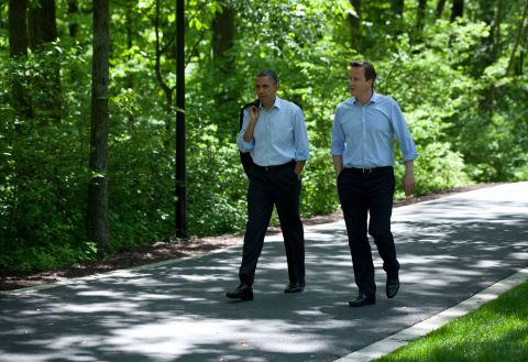Obama and Cameron talk as they make their way to Laurel Cabin.