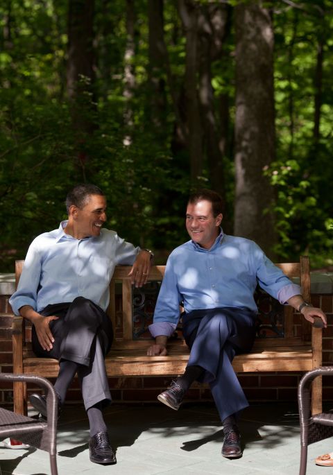Obama and Medvedev talk on the Laurel Cabin patio.