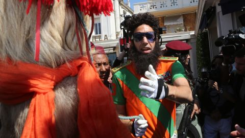 British actor Sacha Baron Cohen dresses in character as Adm. Gen. Aladeen during a photocall to promote his film "The Dictator."