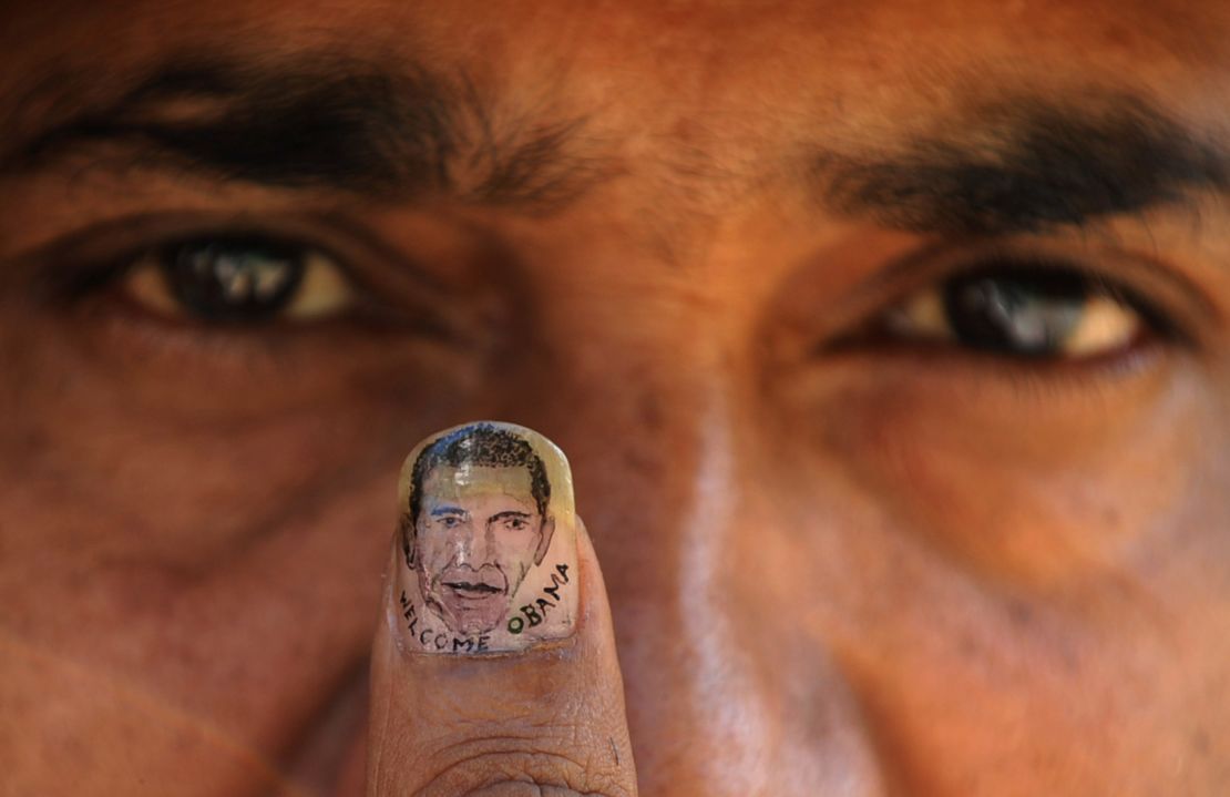 Indian micro-artist Ramesh Sah shows the nail of his thumb painted with an image of Barack Obama in support of his visit to India in 2010.