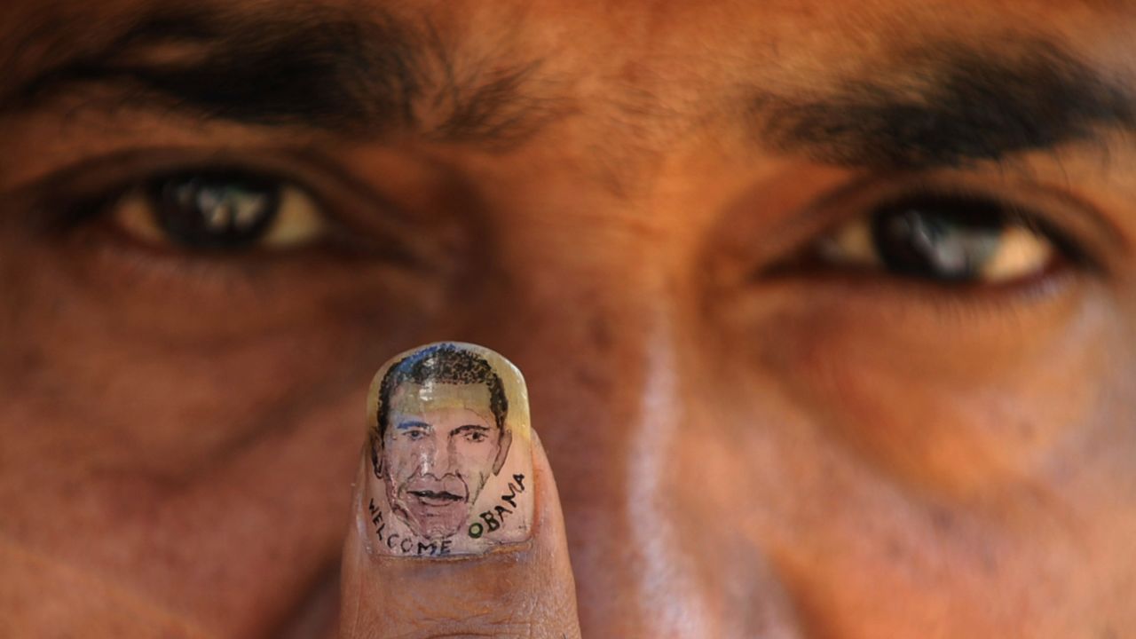 Indian micro-artist Ramesh Sah shows the nail of his thumb painted with an image of Barack Obama in support of his visit to India in 2010.